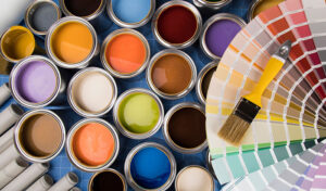 Assorted paint colors and brushes neatly arranged in a palette for easy access and organization.