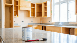Bright kitchen interior showing how to prime kitchen cabinet frames before kitchen cabinet painting.