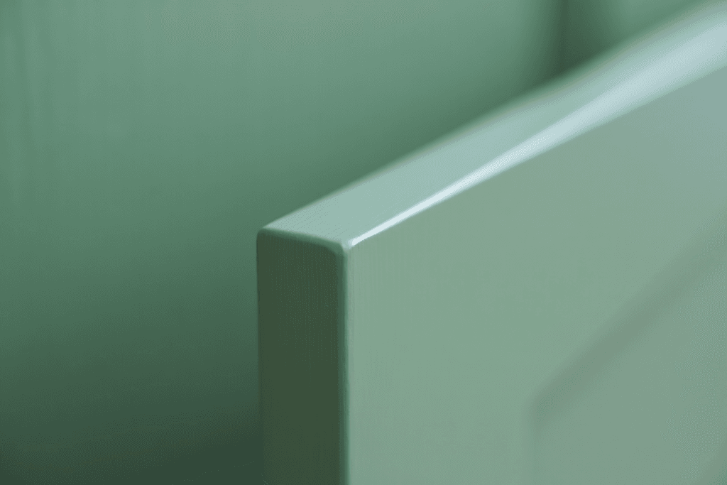 The Ultimate Guide to Restoring Wood Cabinets to Their Former Glory Right in Your Utah Home 2 A detailed close-up showing the flawless, factory-quality surface of a cabinet door painted with a durable 2K polyurethane finish by professionals in Utah.