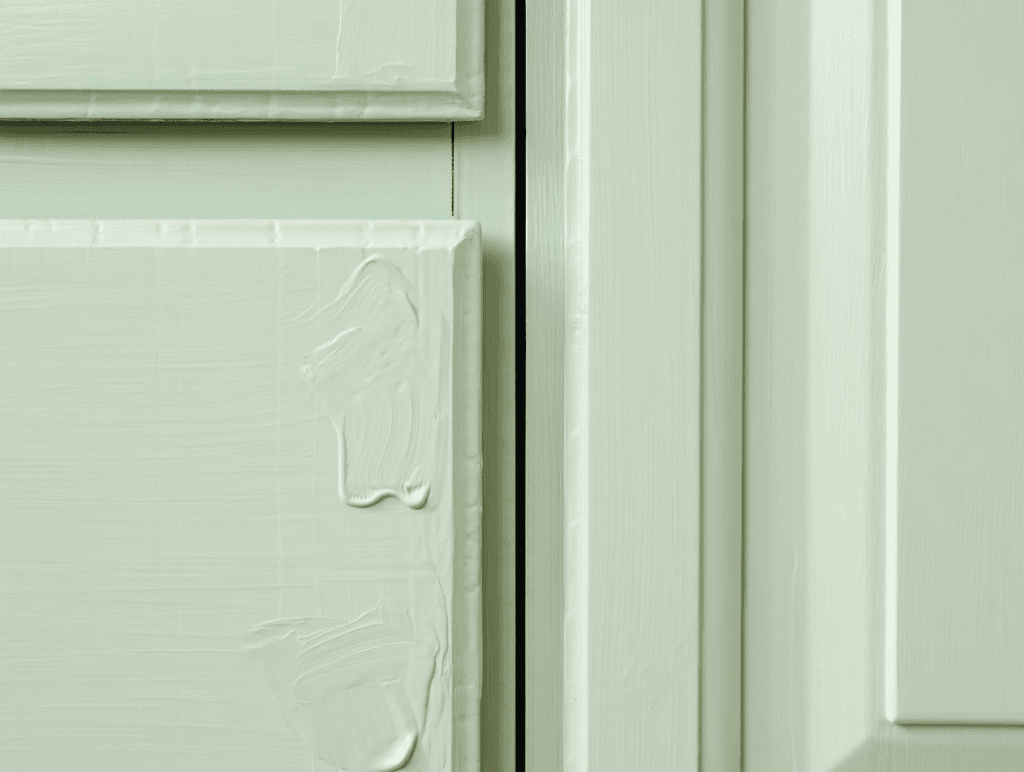 The Ultimate Guide to Restoring Wood Cabinets to Their Former Glory Right in Your Utah Home 4 A comparison of DIY vs. professional cabinet painting, showing visible brush marks on the left and a perfectly smooth, professional finish on the right.