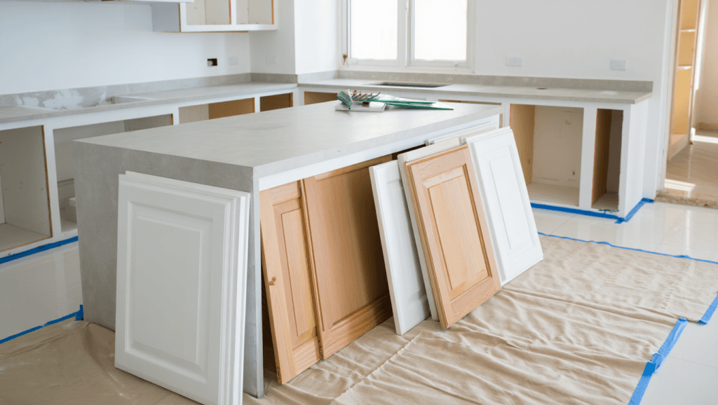 Clean Utah kitchen with cabinet doors removed and cabinet boxes prepped for professional kitchen cabinet painting.