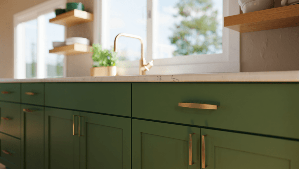 Forest green kitchen cabinets with white oak shelves, brass hardware, and light countertops in a bright Utah kitchen.