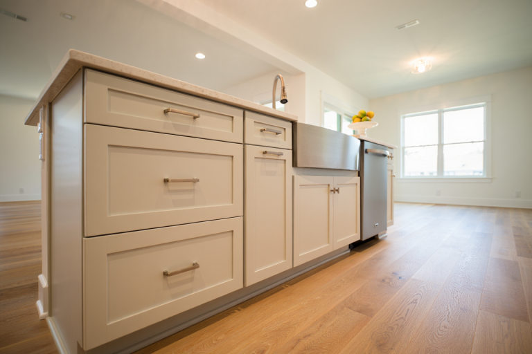 Freshly painted white kitchen cabinets in a Utah home staged for sale, professional satin finish, move-in ready
