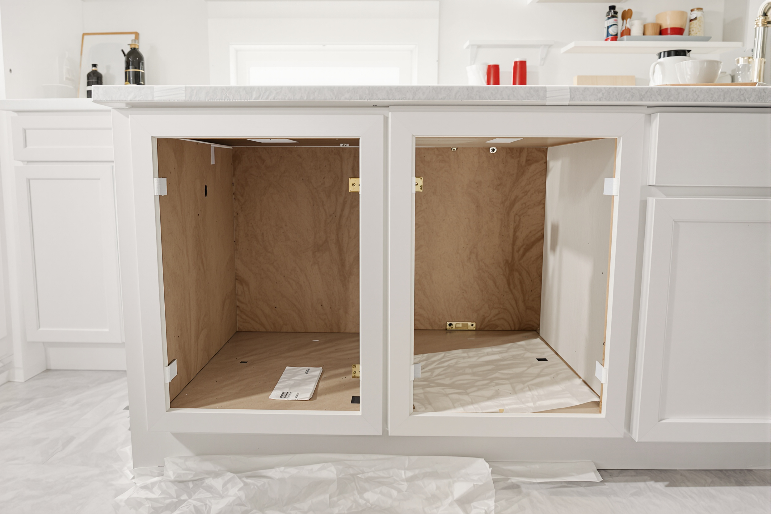 Is Cabinet Painting Messy? 5 Honest, Worry-Free Answers 1 Kitchen cabinet boxes with doors removed for off-site finishing, so cabinet painting stays mess-free inside the home
