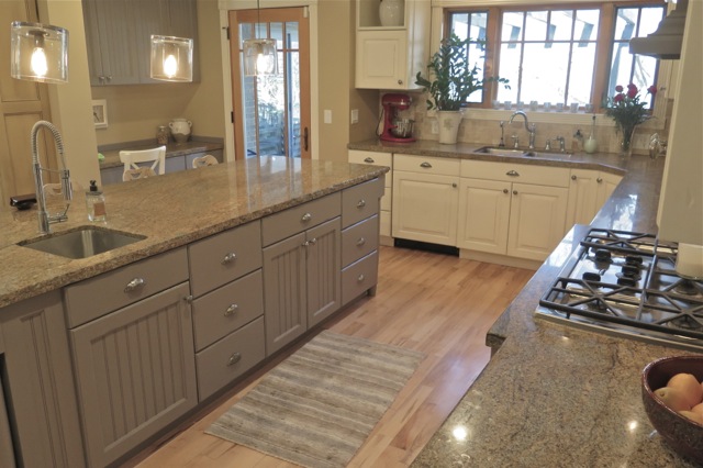 White Kitchen Cabinets With Grey Island And Granite Countertops